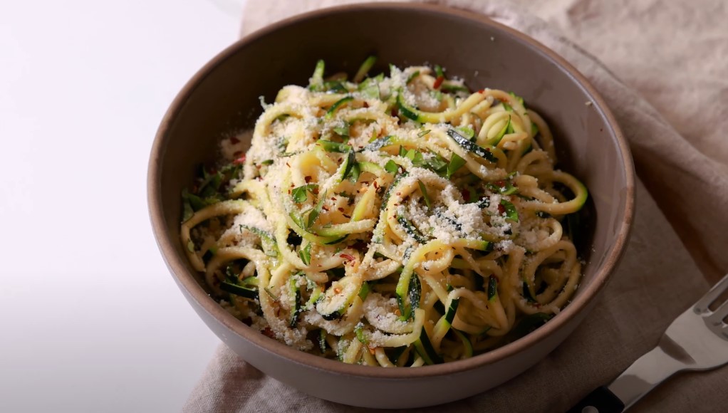 Close up view of vibrant bowl of zucchini noodles