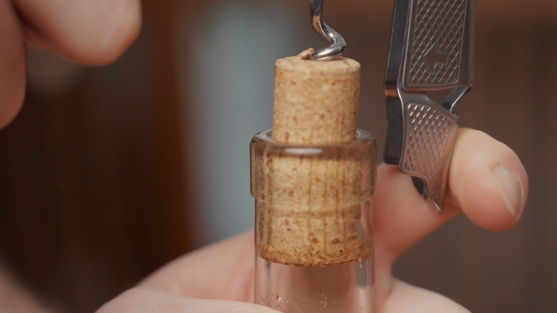 A Person Opening a Bottle, Demonstrating the Use of Alcohol in Cooking
