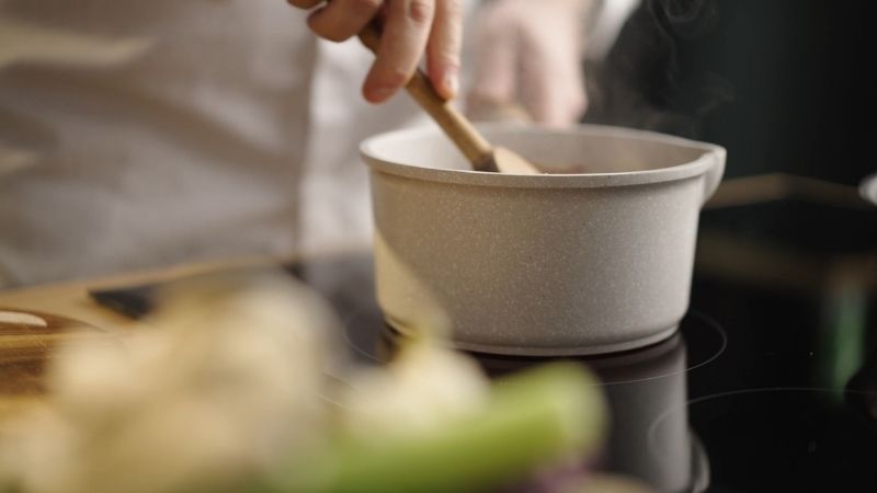 Stirring sauce on the stovetop