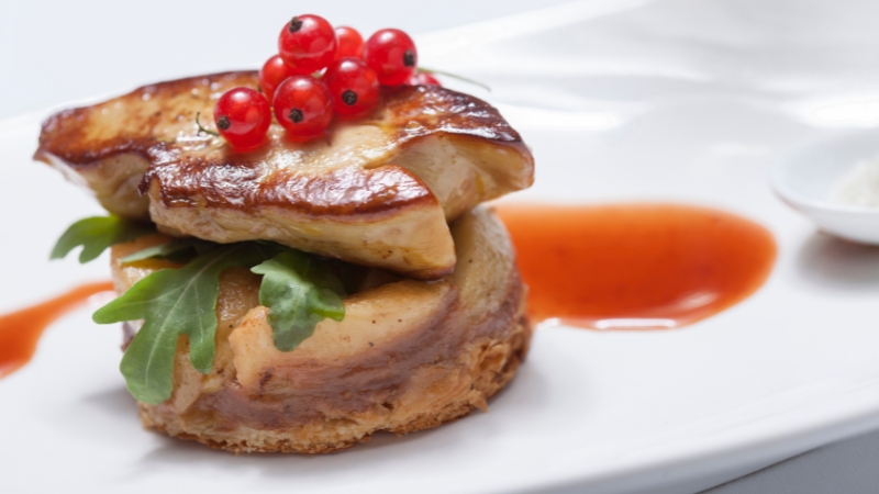 A neatly plated dish with balanced portions and open space highlights elegant presentation
