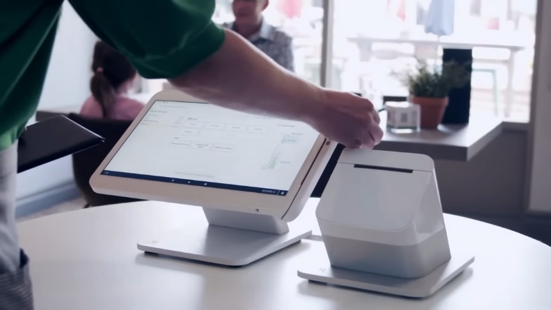 Clover POS setup with a customer-facing screen and printer on a counter