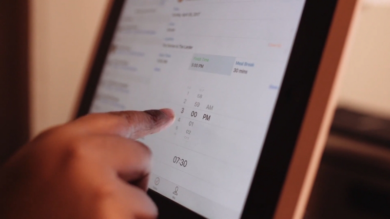 Using Deputy scheduling app on a tablet to adjust shift times