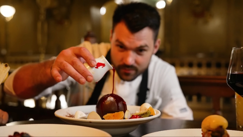 Chef plating a modern Romanian dessert at one of the top dining spots in Bucharest
