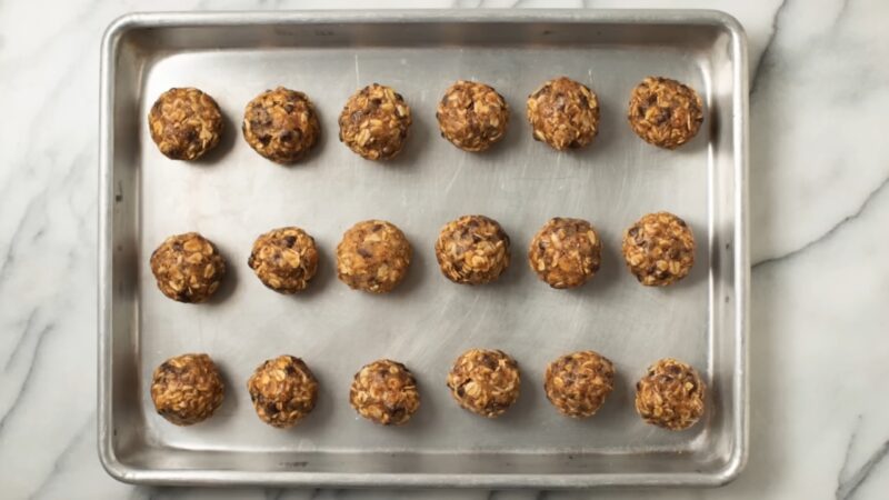 No-bake energy balls arranged on a baking sheet to chill
